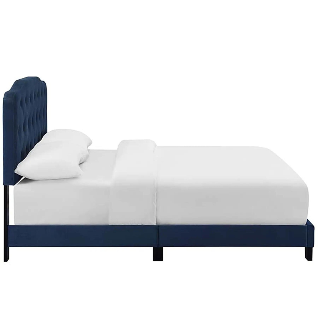 Velvet-upholstered wings bed for a plush look