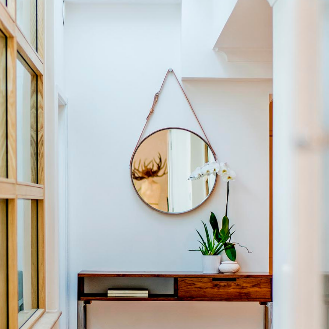 "Handcrafted leather accent mirror for a unique and personalized touch."
