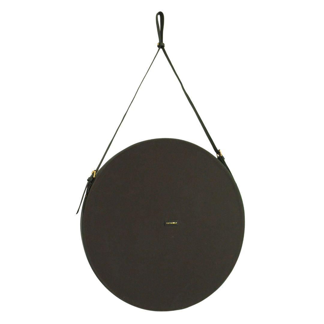 "Leather strap hanging mirror with a minimalist frame for versatile wall decor."
