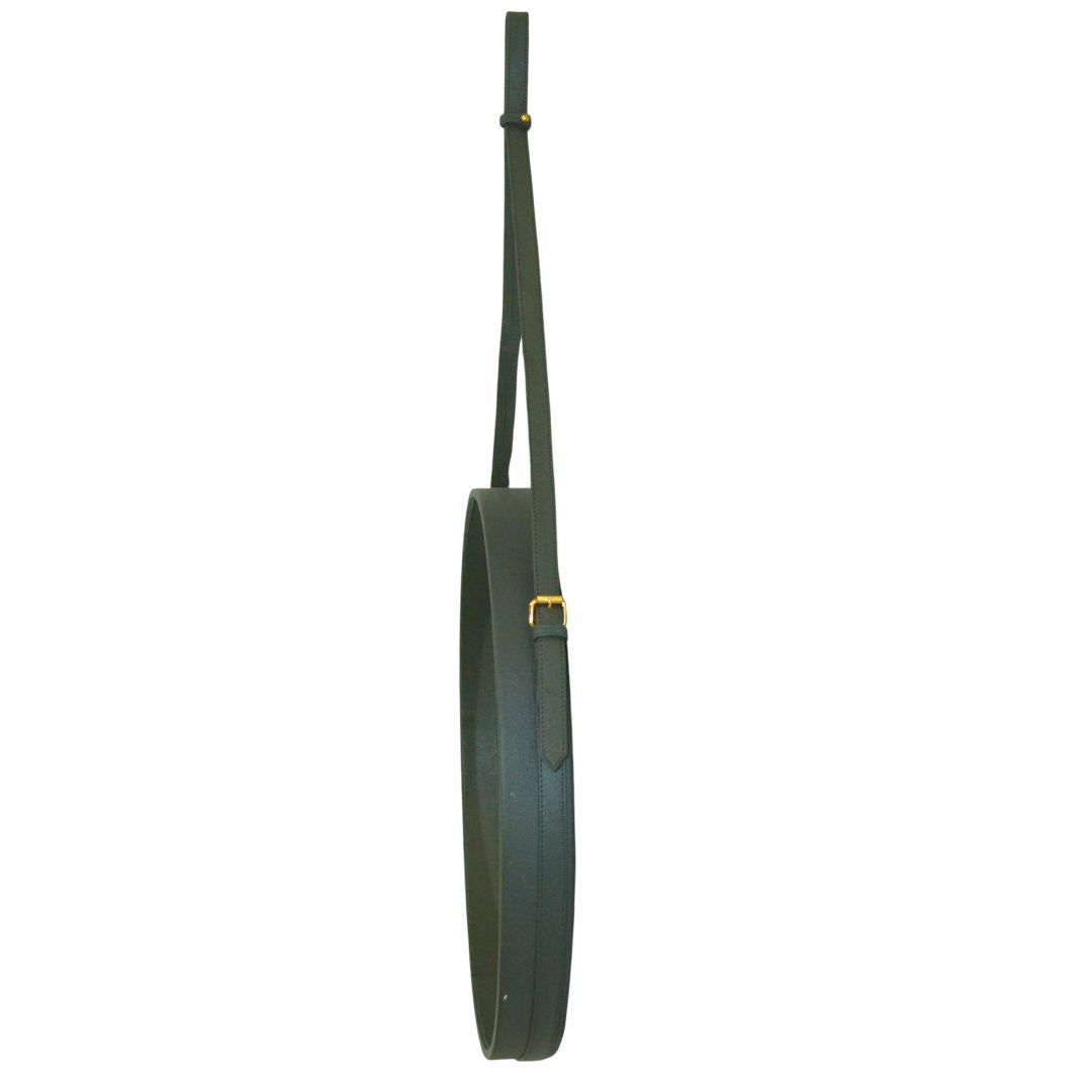 "Minimalist green leather mirror, perfect for sleek modern interiors."
