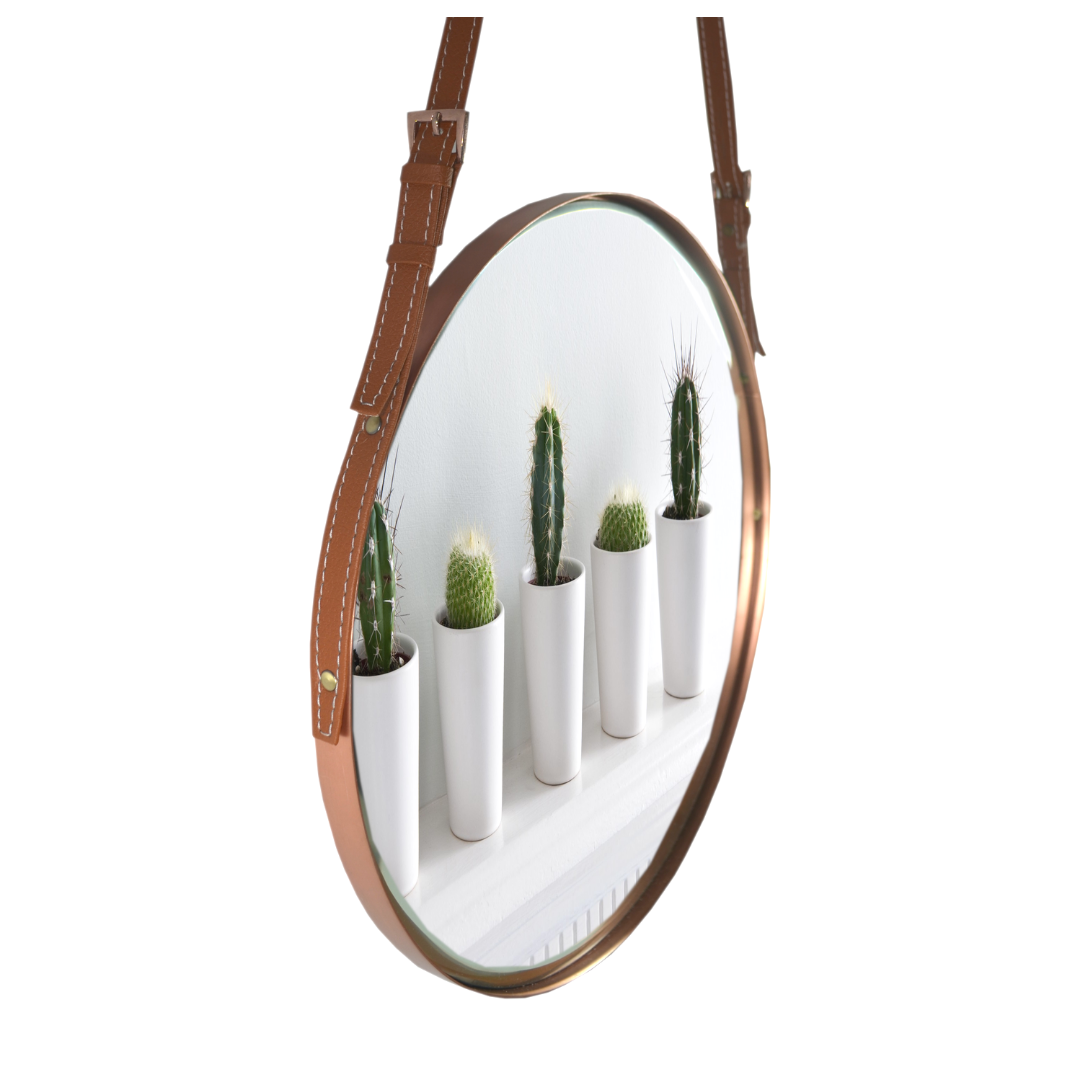 "Minimalist round mirror with a smooth leather edge, ideal for any room decor."
