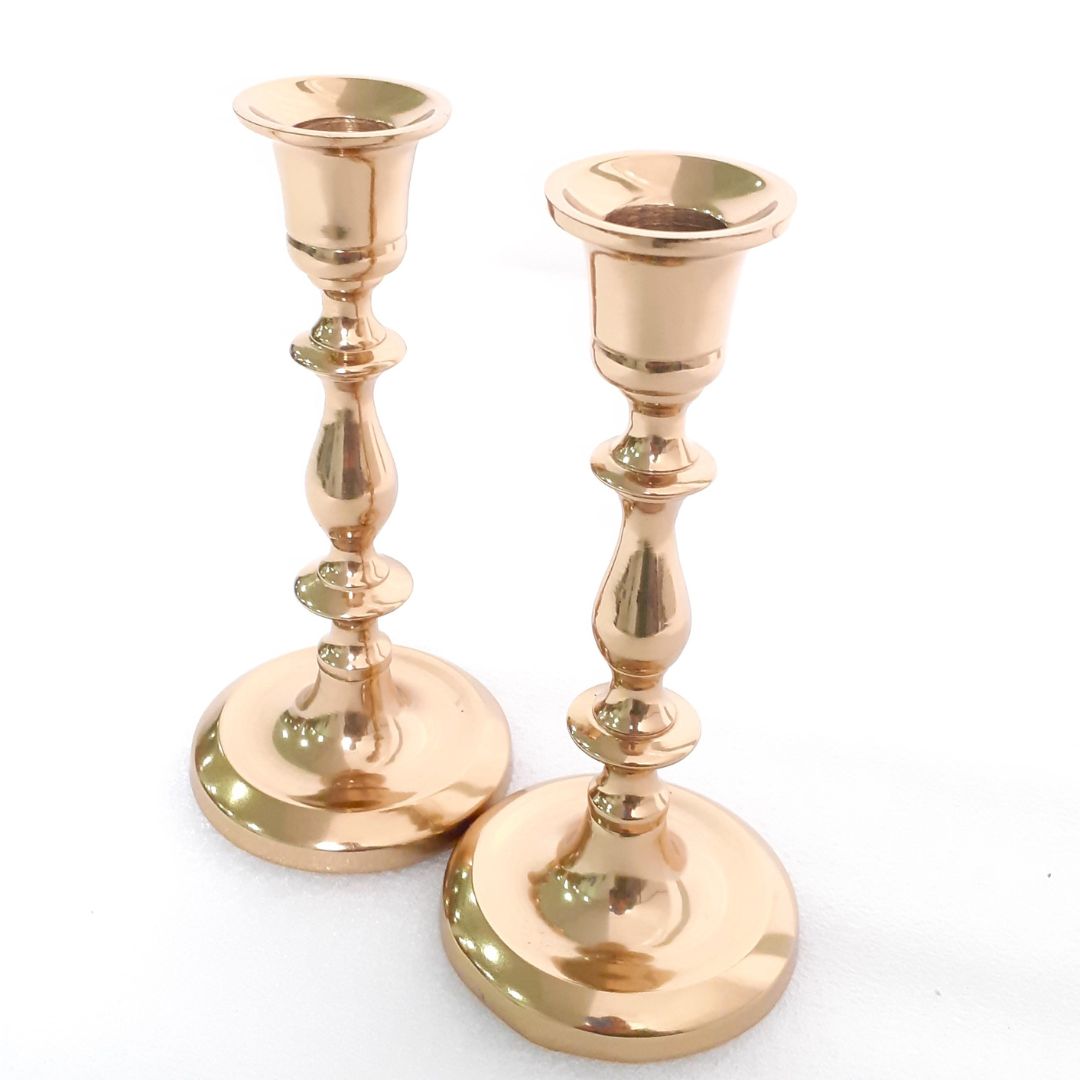 Pair of brass candle holders for chic decor
