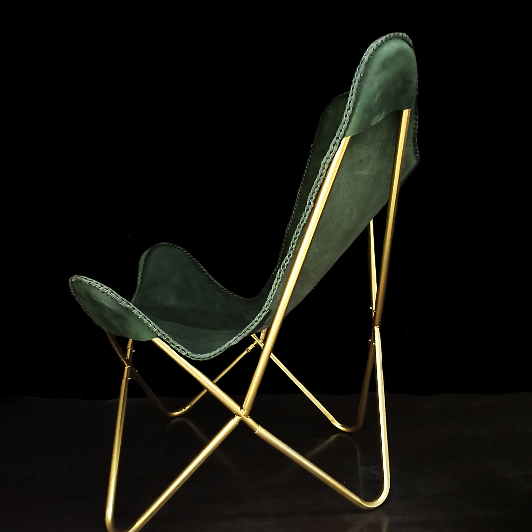 Modern polished leather chair with metal leg accents

