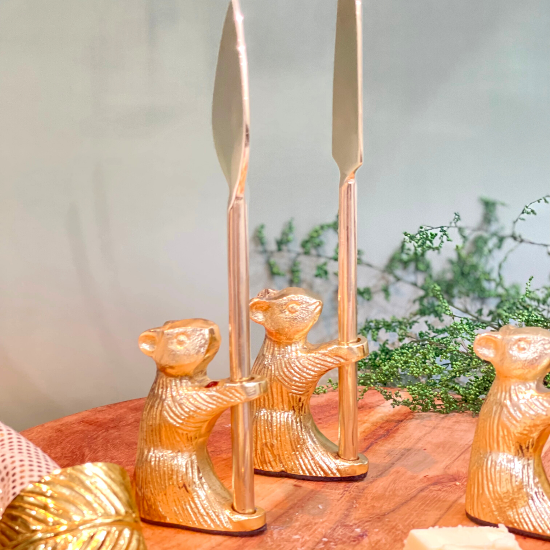 High-end cheese knives with gold accents
