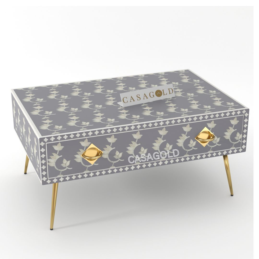 "Rectangular coffee table with abstract bone inlay artwork"
