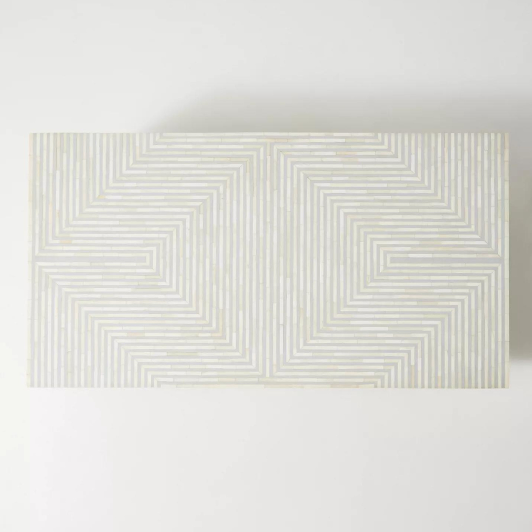 "Rectangular coffee table with intricate geometric bone inlay design"
