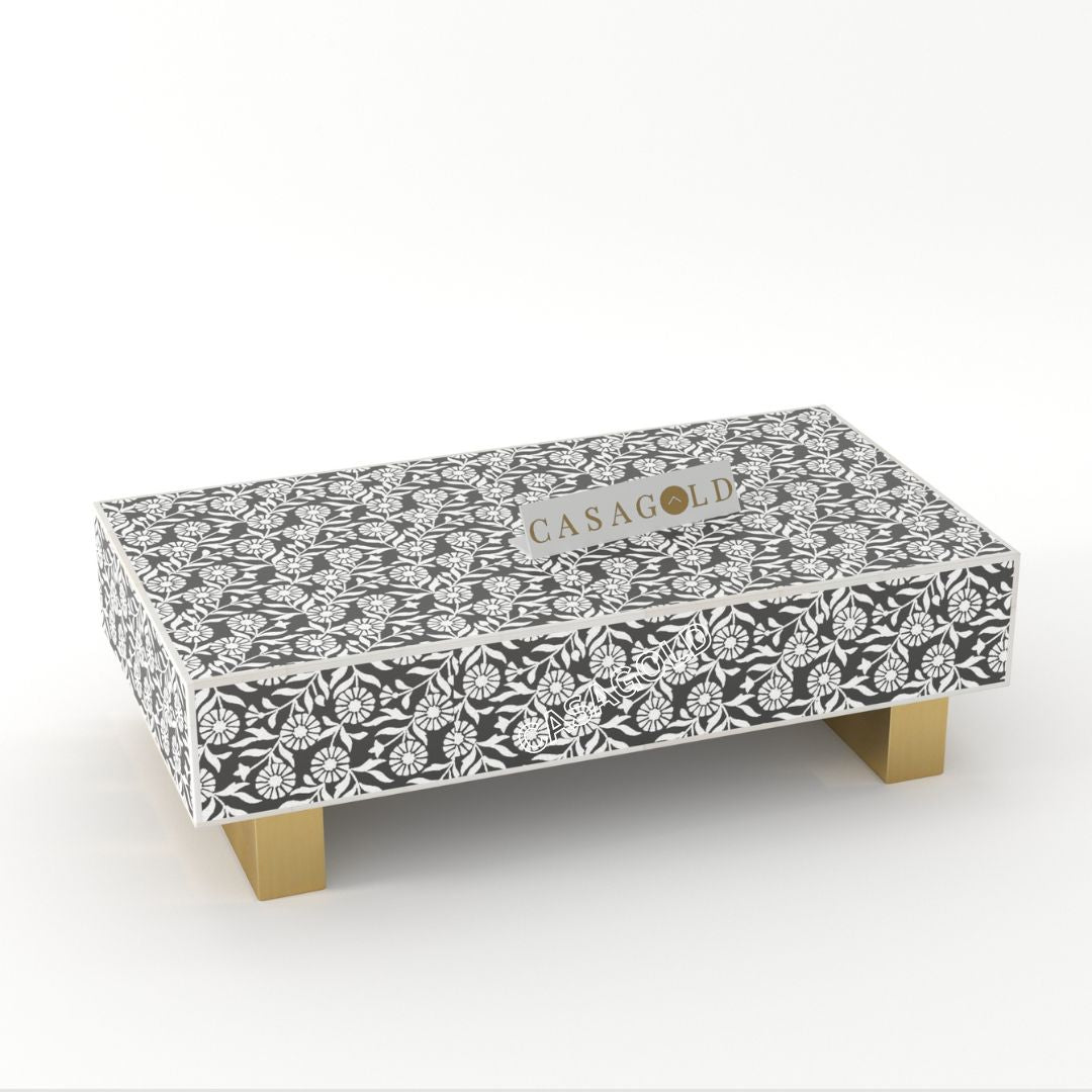 "Rectangular coffee table with tribal-inspired bone inlay designs"
