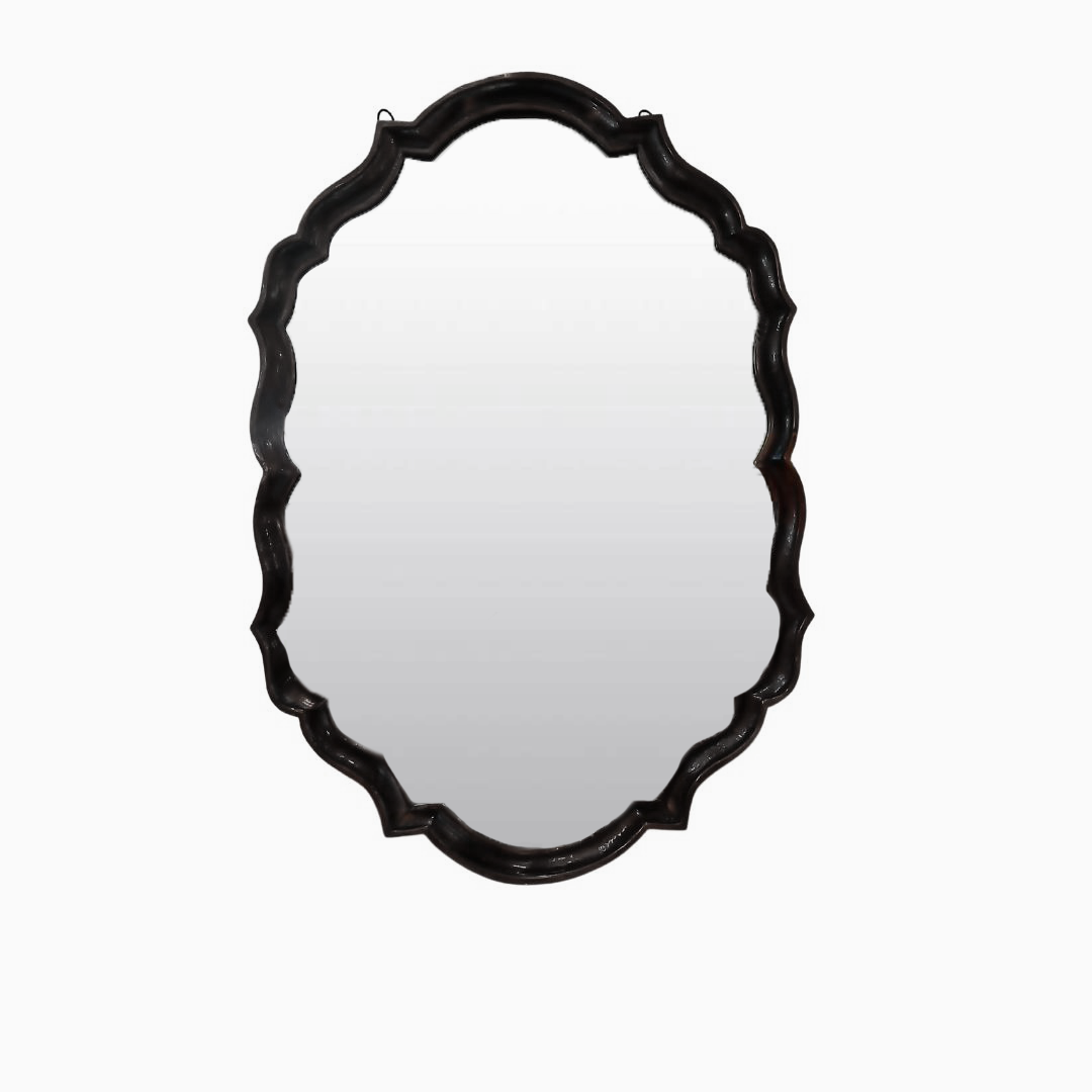 Vintage glass wall mirror featuring floral etching
